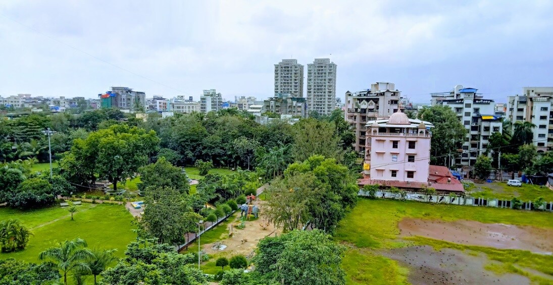 Vashi Sector 29_a large building with a clock tower in the middle of it